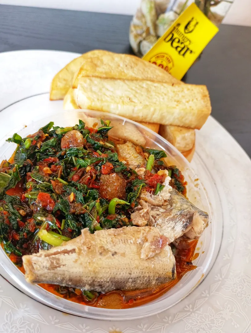 Fried yam with green vegetable and sardine sauce