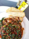 Fried yam with green veggies sauce
