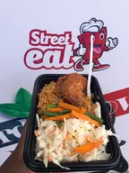 Jollof with grilled chicken and coslow